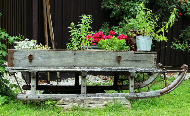 Unusual Garden Ornaments - Sleigh in the garden with flower pots